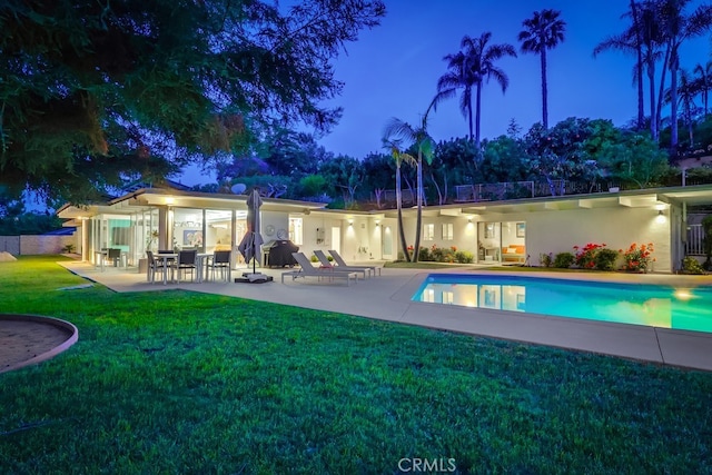 27649 Palos Verdes Dr E, Rancho Palos Verdes, CA 90275 - pool at night featuring a patio, a lawn, and an outdoor pool