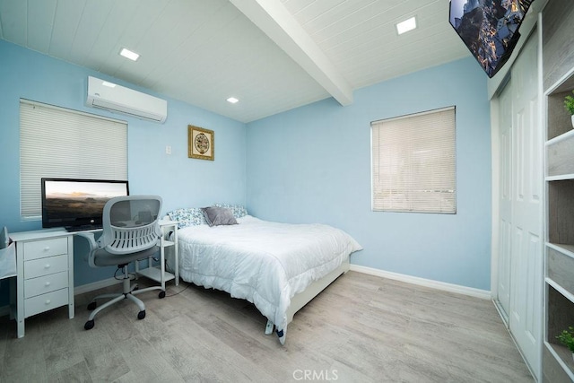 3603 W 144th Pl, Hawthorne, CA 90250 - bedroom with an AC wall unit, wood finished floors, baseboards, and beam ceiling