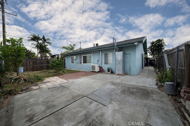 3603 W 144th Pl, Hawthorne, CA 90250 - back of property featuring stucco siding, a patio, a fenced backyard, and a cooling unit
