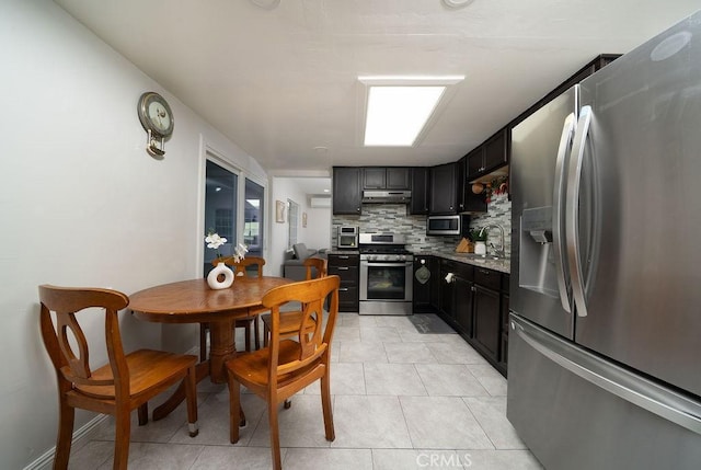 3603 W 144th Pl, Hawthorne, CA 90250 - kitchen featuring appliances with stainless steel finishes, backsplash, a sink, under cabinet range hood, and light tile patterned flooring