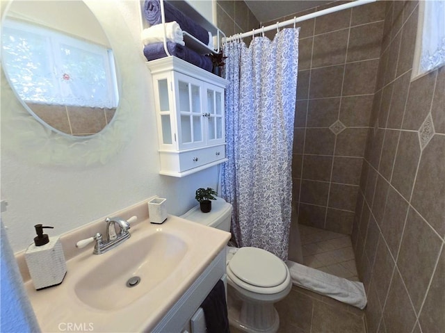 15043 S Culver Rd, Victorville, CA 92394 - bathroom featuring a tile shower, toilet, vanity, and tile patterned floors
