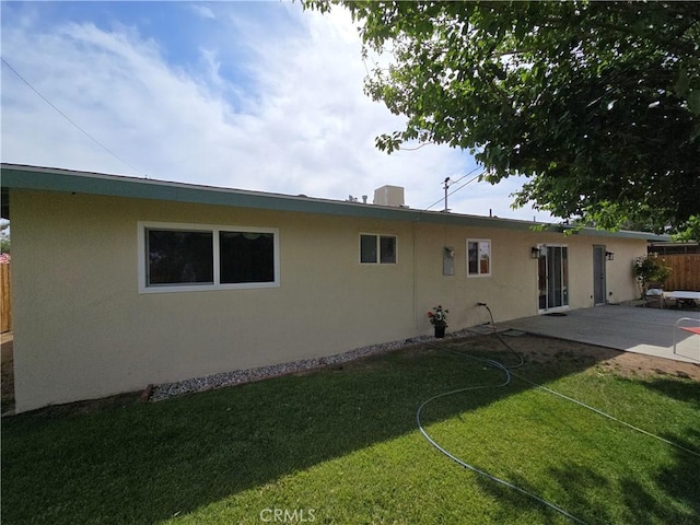15043 S Culver Rd, Victorville, CA 92394 - back of property with stucco siding and a patio area