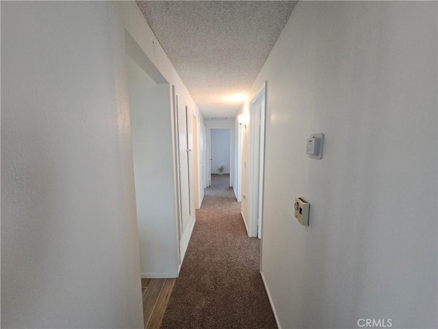 15043 S Culver Rd, Victorville, CA 92394 - hall with a textured ceiling, carpet, and baseboards