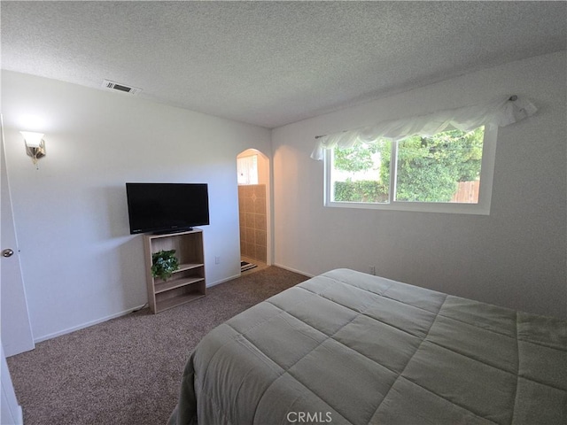 15043 S Culver Rd, Victorville, CA 92394 - bedroom with arched walkways, carpet, a textured ceiling, and baseboards