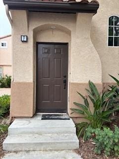 39244 Turtle Bay Ln Unit F, Murrieta, CA 92563 - view of exterior entry featuring stucco siding