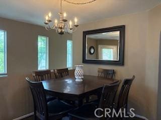 39244 Turtle Bay Ln Unit F, Murrieta, CA 92563 - dining area featuring healthy amount of natural light, a chandelier, and baseboards