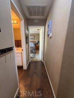 39244 Turtle Bay Ln Unit F, Murrieta, CA 92563 - hallway with dark wood-style flooring and baseboards