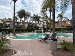 39244 Turtle Bay Ln Unit F, Murrieta, CA 92563 - community pool with a patio area and a residential view