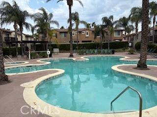 39244 Turtle Bay Ln Unit F, Murrieta, CA 92563 - community pool with a community hot tub, a patio area, and a residential view
