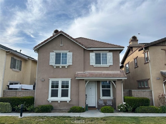 14621 Longwood Ave, Chino, CA 91710 - traditional-style house with stucco siding and a tiled roof