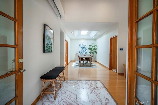 29111 Pompano Way, Laguna Niguel, CA 92677 - hall featuring a skylight, light wood-style flooring, and baseboards