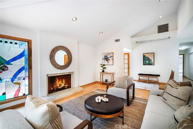 29111 Pompano Way, Laguna Niguel, CA 92677 - living area featuring wood finished floors, a fireplace, high vaulted ceiling, baseboards, and recessed lighting