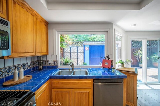 29111 Pompano Way, Laguna Niguel, CA 92677 - kitchen featuring dishwashing machine, a sink, tile counters, and tile patterned floors