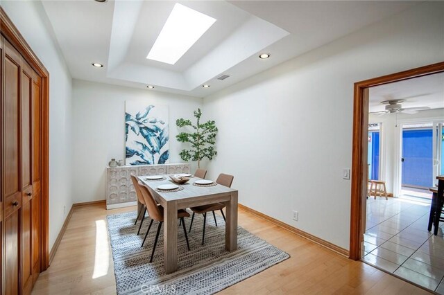 29111 Pompano Way, Laguna Niguel, CA 92677 - dining room featuring a skylight, light wood-type flooring, a raised ceiling, and recessed lighting