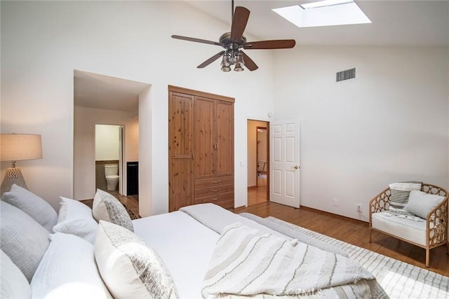 29111 Pompano Way, Laguna Niguel, CA 92677 - bedroom with a skylight, wood finished floors, high vaulted ceiling, connected bathroom, and a ceiling fan