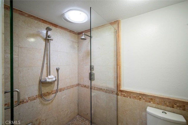29111 Pompano Way, Laguna Niguel, CA 92677 - bathroom featuring a shower stall, wainscoting, and tile walls