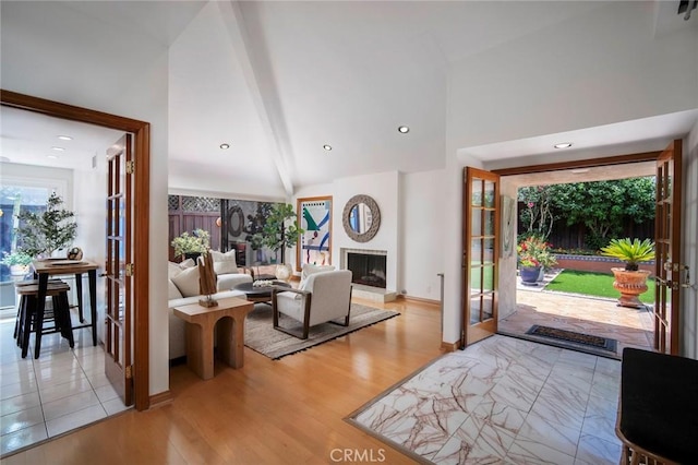 29111 Pompano Way, Laguna Niguel, CA 92677 - entrance foyer with wood finished floors, beam ceiling, a fireplace, high vaulted ceiling, and french doors