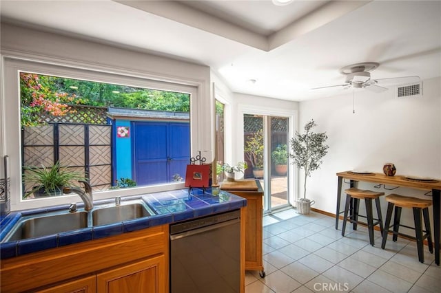 29111 Pompano Way, Laguna Niguel, CA 92677 - kitchen with dishwasher, a sink, light tile patterned floors, ceiling fan, and tile countertops