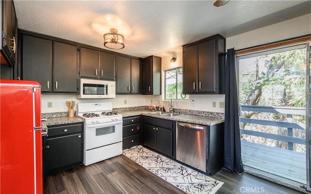 29148 Lyon Dr, Cedar Glen, CA 92321 - kitchen featuring white appliances, a sink, and dark wood-style floors