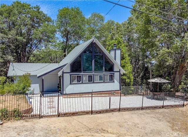 29148 Lyon Dr, Cedar Glen, CA 92321 - view of front of house featuring a chimney and a patio area