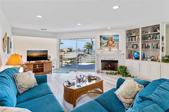 718 W 37th St Unit 4, San Pedro, CA 90731 - living room featuring a lit fireplace, wood finished floors, and recessed lighting