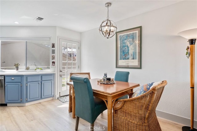 718 W 37th St Unit 4, San Pedro, CA 90731 - dining area with light wood-type flooring, a chandelier, and baseboards