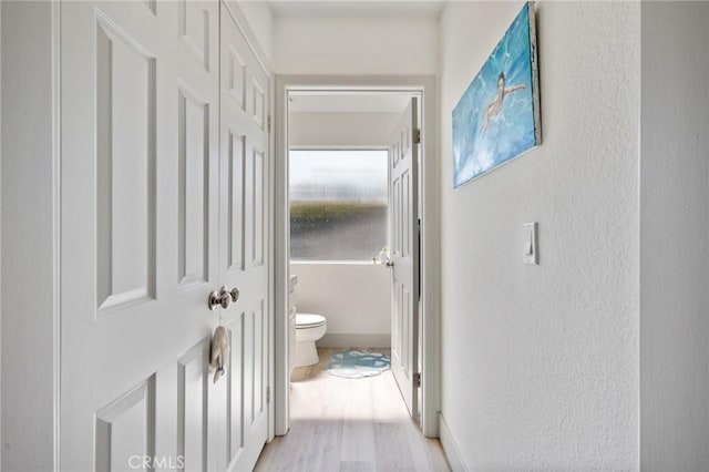 718 W 37th St Unit 4, San Pedro, CA 90731 - bathroom with toilet, a textured wall, wood finished floors, and baseboards