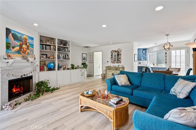 718 W 37th St Unit 4, San Pedro, CA 90731 - living room featuring light wood-style flooring, a tile fireplace, and recessed lighting