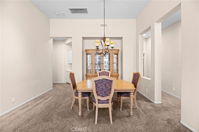 41799 Cascades Ct, Temecula, CA 92591 - carpeted dining area with a chandelier and baseboards
