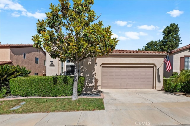 41799 Cascades Ct, Temecula, CA 92591 - mediterranean / spanish-style house with a garage, stucco siding, concrete driveway, and a tiled roof