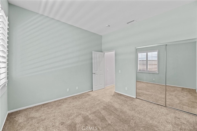 41799 Cascades Ct, Temecula, CA 92591 - unfurnished bedroom with carpet, vaulted ceiling, a closet, and baseboards
