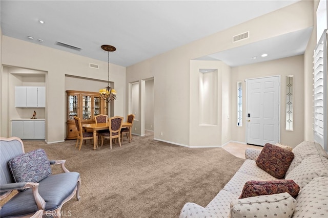 41799 Cascades Ct, Temecula, CA 92591 - living area with carpet, baseboards, and a chandelier