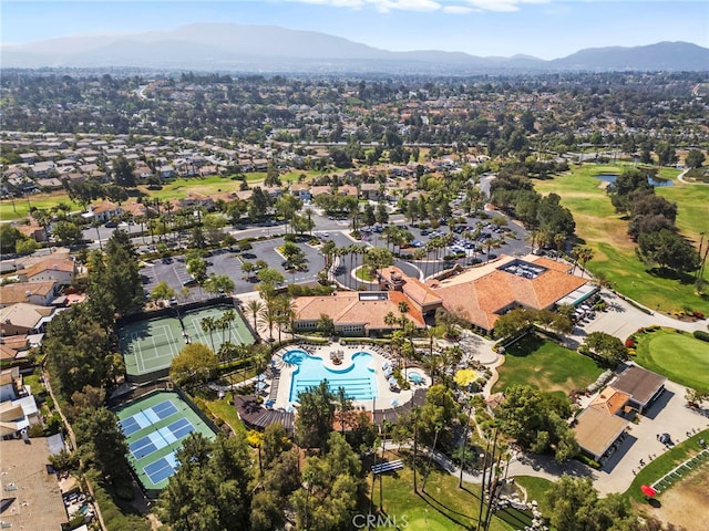 41799 Cascades Ct, Temecula, CA 92591 - aerial view of property and surrounding area featuring a mountain backdrop, a pool, nearby suburban area, and a golf course
