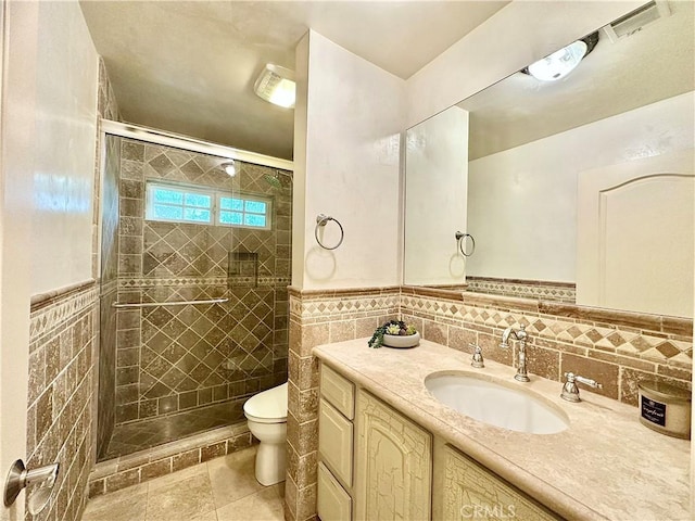 5703 Evening Canyon Dr, La Canada Flintridge, CA 91011 - bathroom with vanity, toilet, a shower stall, tile walls, and a wainscoted wall