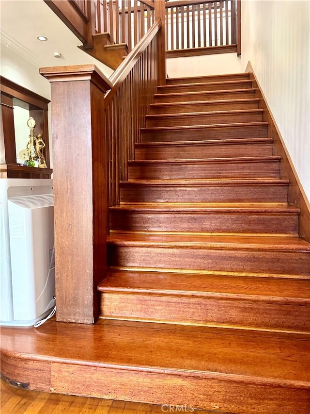 867 S Bronson Ave, Los Angeles, CA 90005 - stairs featuring hardwood / wood-style floors