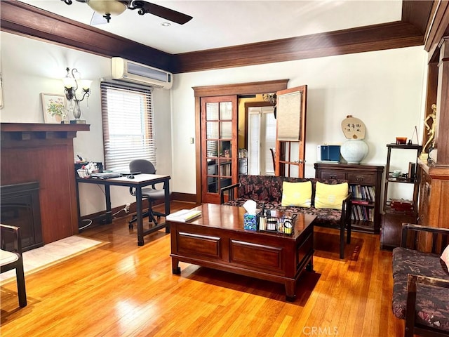 867 S Bronson Ave, Los Angeles, CA 90005 - office with a fireplace, a wall mounted air conditioner, light wood finished floors, ceiling fan, and crown molding