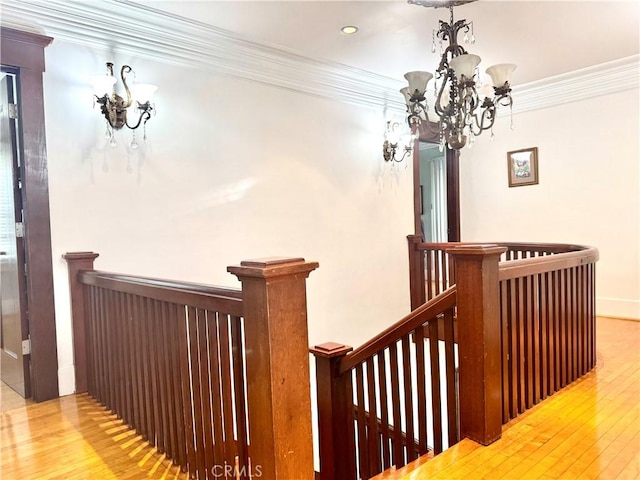 867 S Bronson Ave, Los Angeles, CA 90005 - stairs featuring a chandelier, ornamental molding, wood-type flooring, recessed lighting, and baseboards
