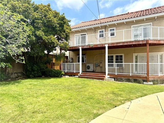 867 S Bronson Ave, Los Angeles, CA 90005 - back of house with ac unit, stucco siding, a lawn, and a tiled roof