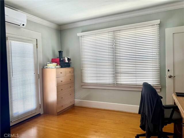 867 S Bronson Ave, Los Angeles, CA 90005 - office with a wall mounted AC, baseboards, light wood-type flooring, ornamental molding, and plenty of natural light
