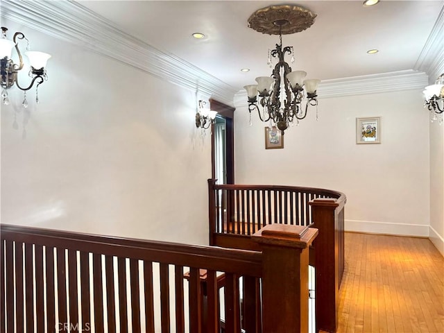 867 S Bronson Ave, Los Angeles, CA 90005 - corridor with a chandelier, an upstairs landing, crown molding, recessed lighting, and light wood-type flooring