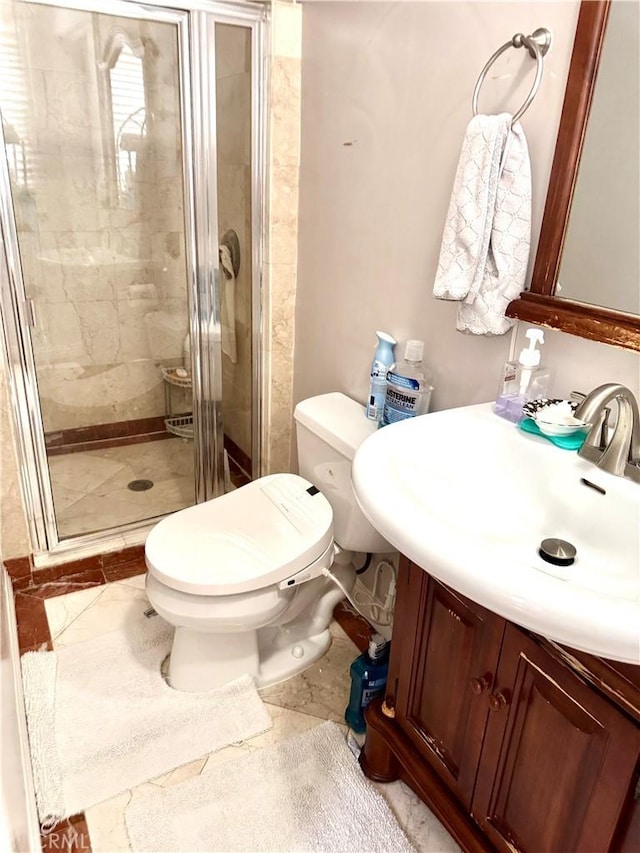 867 S Bronson Ave, Los Angeles, CA 90005 - bathroom featuring vanity, toilet, and a stall shower