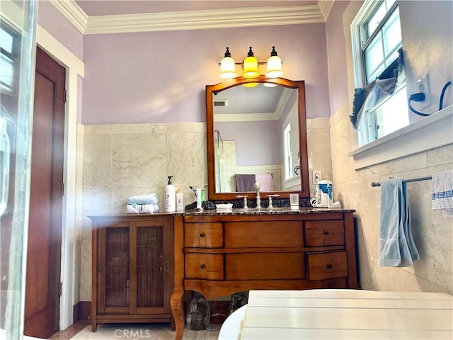 867 S Bronson Ave, Los Angeles, CA 90005 - bathroom with tile walls, vanity, and crown molding