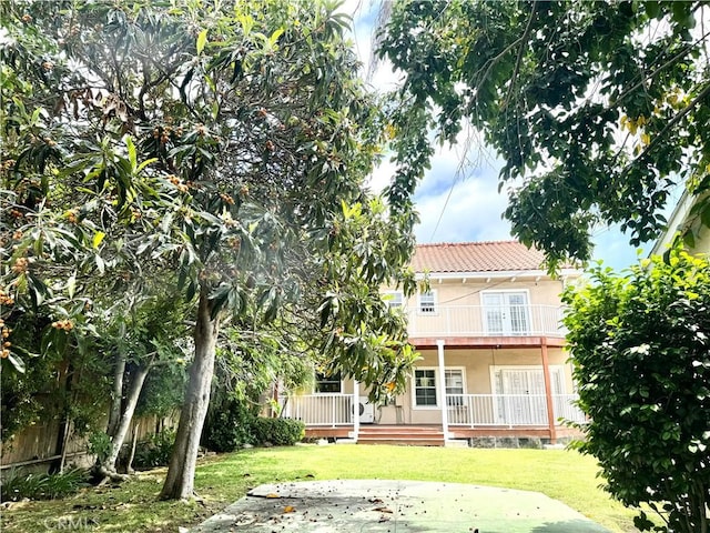 867 S Bronson Ave, Los Angeles, CA 90005 - back of house featuring a tile roof and stucco siding