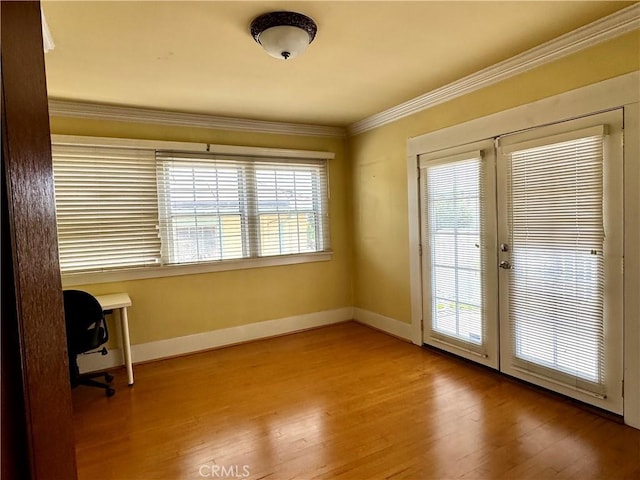 867 S Bronson Ave, Los Angeles, CA 90005 - spare room featuring french doors, crown molding, wood finished floors, baseboards, and an office area