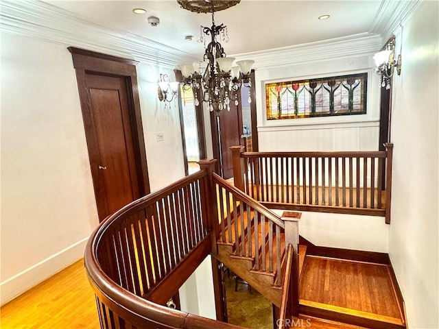 867 S Bronson Ave, Los Angeles, CA 90005 - staircase with a chandelier, wood finished floors, baseboards, crown molding, and recessed lighting