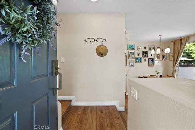 2348 Sunningdale Dr, Tustin, CA 92782 - foyer entrance featuring a chandelier, wood finished floors, and baseboards