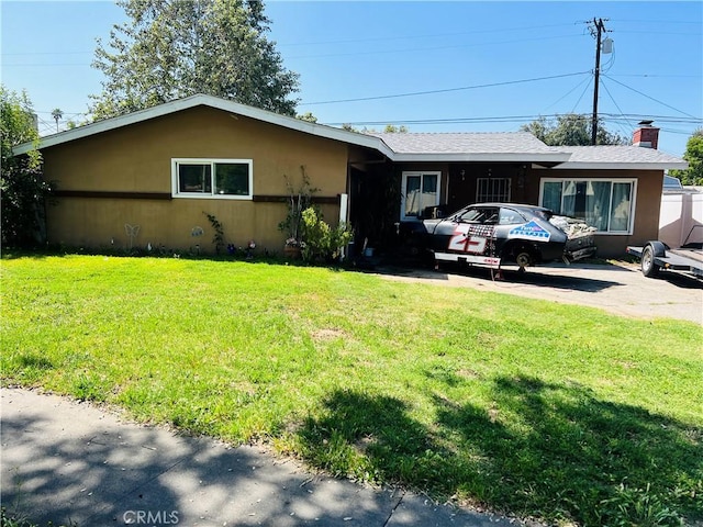 122 E Pioneer Ave, Redlands, CA 92374 - ranch-style home with a front yard and stucco siding