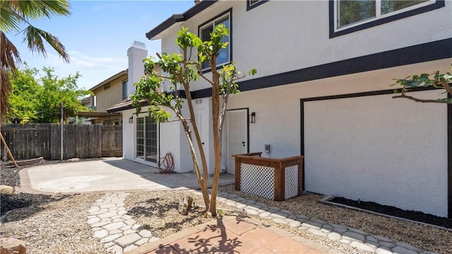 7059 Potenza Pl, Rancho Cucamonga, CA 91701 - view of home's exterior with stucco siding and a patio area