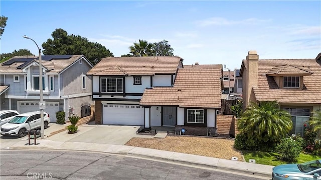 7059 Potenza Pl, Rancho Cucamonga, CA 91701 - view of front of property featuring driveway, a garage, stucco siding, a residential view, and a chimney