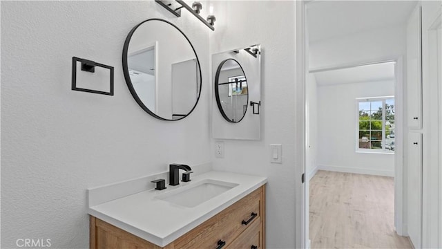 7059 Potenza Pl, Rancho Cucamonga, CA 91701 - bathroom featuring vanity and wood finished floors